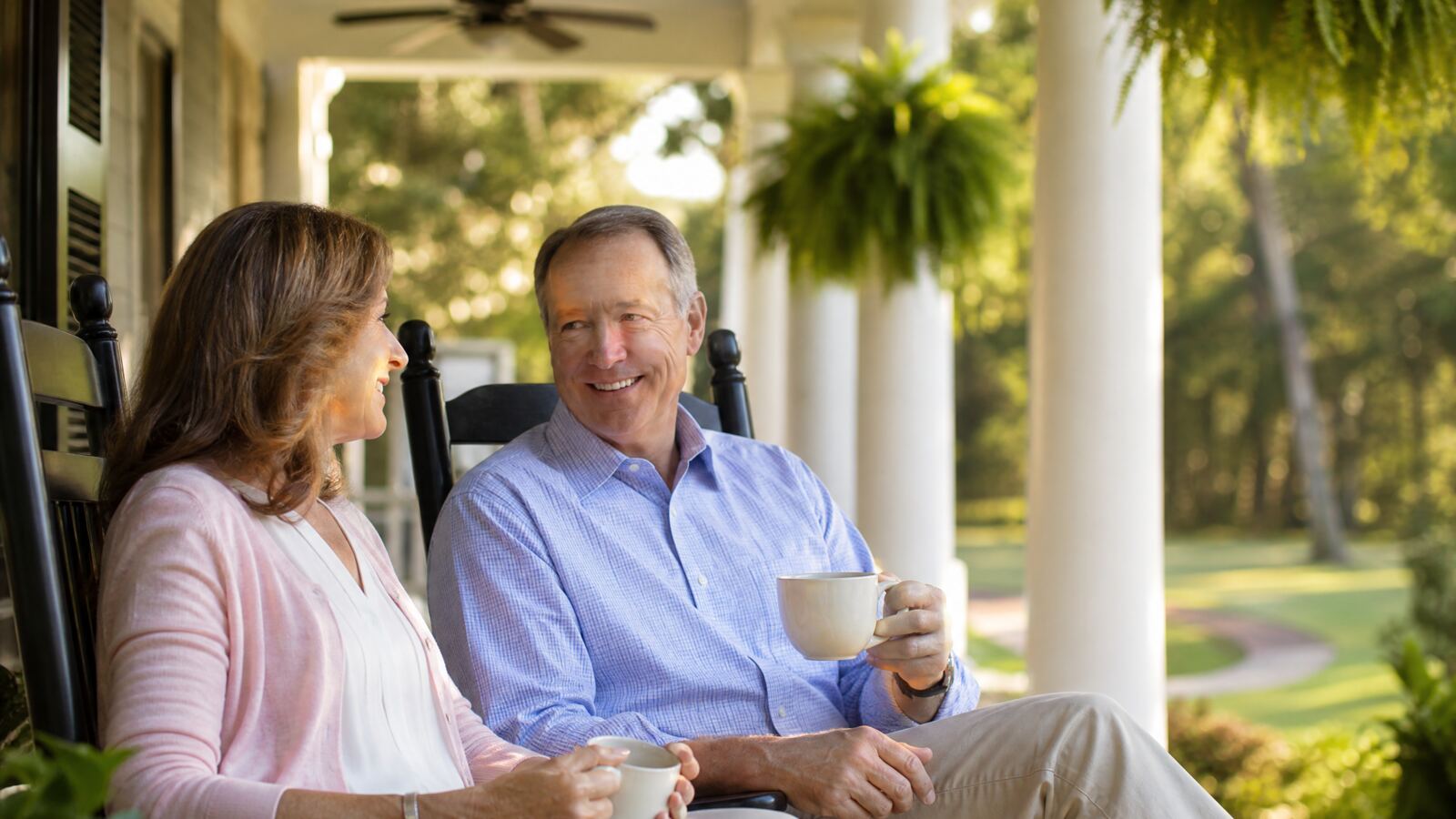 Retired couple relaxing together on a North Carolina front porch
